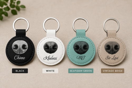 Signature NosePrint keychains in black, white, seafoam green and vintage beige